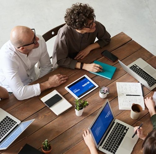 Le Monde Consulting team members in a business meeting discussing digital transformation strategies